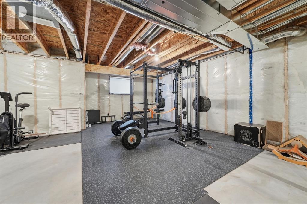 902 Bluerock Way Sw, Calgary, Alberta  T2Y 0S5 - Photo 28 - A2286798