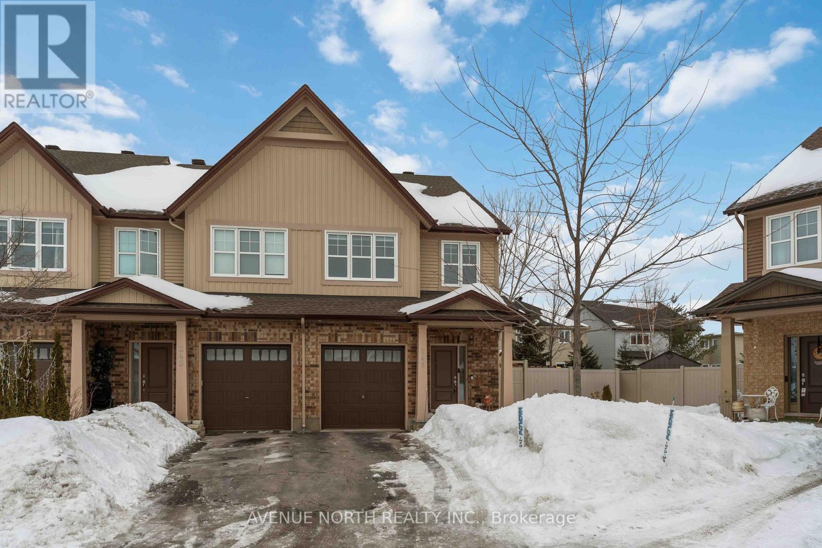 Welcome to 345 Alasken Drive! This beautifully maintained 3-bedroom, 2.5-bathroom END-unit Granite model townhome offers the feel of a single-family home and sits on a massive pie-shaped lot with an impressive fully fenced (PVC) rear yard. Ideally located close to parks, schools, shopping, and everyday amenities, this home delivers the perfect balance of space, style, and convenience. The main level features impressive 9-foot ceilings, immaculate hardwood flooring, and a bright, open-concept layout with generous principal rooms - ideal for both everyday living and entertaining. The kitchen is thoughtfully designed with granite countertops, stainless steel appliances, a large centre island, and ample cabinetry. The adjoining dining and living areas overlook the expansive backyard retreat, complete with a patio stone/gazebo lounge area and low-maintenance landscaping. With its rare pie-shaped design, the rear yard offers exceptional outdoor space - plenty of room for kids to play, to host gatherings, and even space to accommodate a future swimming pool. Upstairs, you'll find brand new hardwood flooring throughout the entire second level. The spacious primary bedroom offers a walk-in closet and a 4 piece ensuite bathroom. Two additional well-sized bedrooms and a full bathroom complete this floor. The finished lower level features a family room with a cozy gas fireplace, a bathroom rough-in, and generous storage space. With its oversized lot and move-in ready condition, this exceptional end-unit townhome is a must-see. Book your showing today! (id:48254)