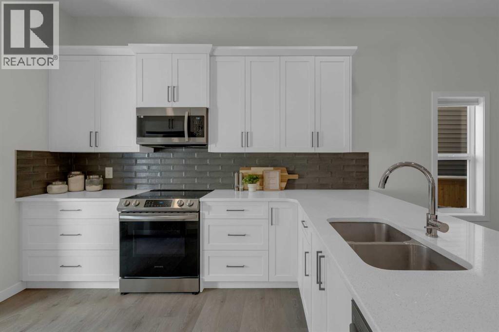 812 Reynolds Manor Sw, Airdrie, Alberta  T4B 5G2 - Photo 7 - A2287244