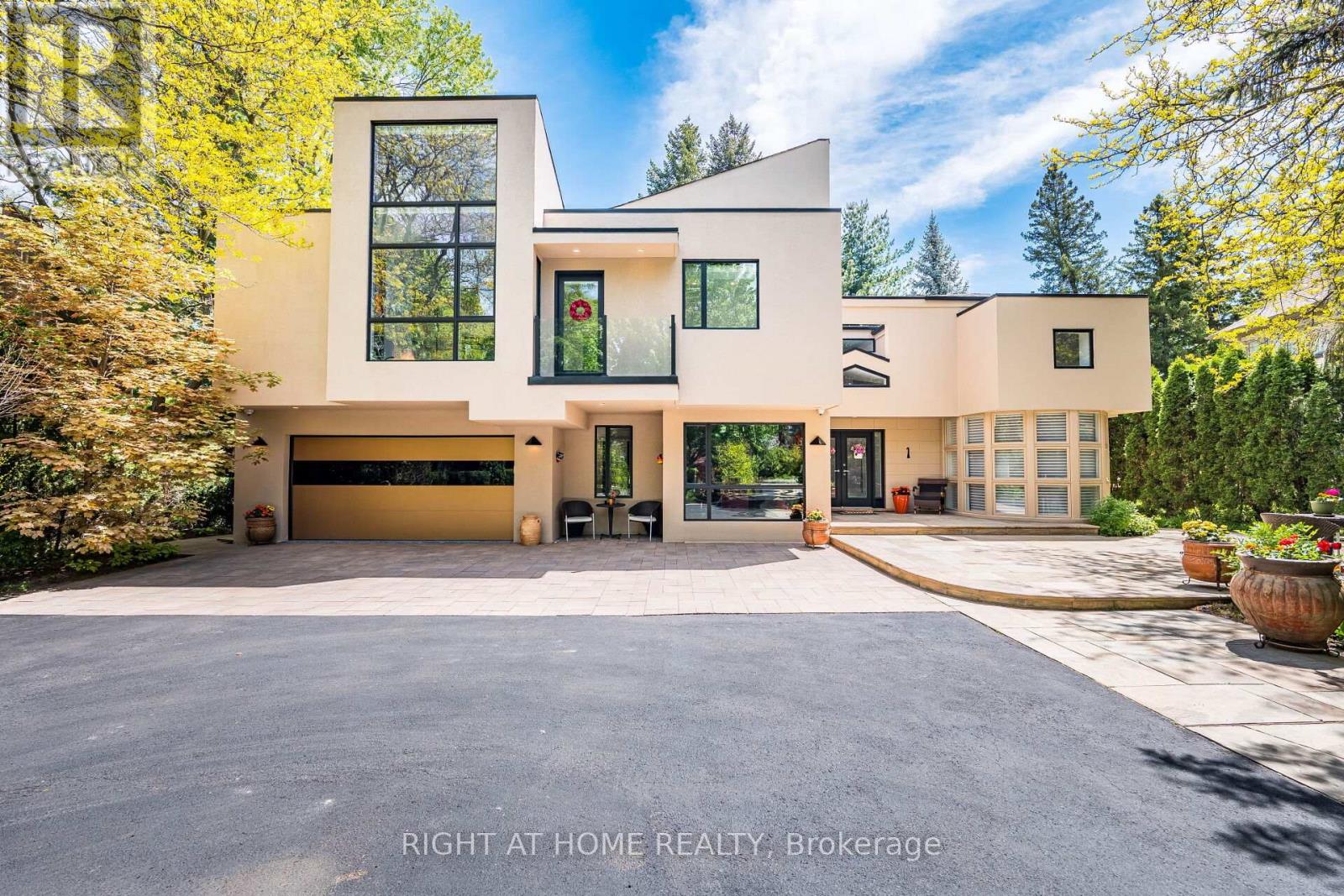 If You're Searching For A Cookie-Cutter Home With No Personality, This Is Not It. But If You Want A Truly One-Of-A-Kind Architectural Statement In One Of The Most Sought-After Pockets Of Etobicoke, Welcome Home! Privately Nestled On A Quiet Cul-De-Sac In Thorncrest Village, This Extraordinary 5+1 Bedroom Residence Is An Architectural Masterpiece Designed By Renowned Architect Rocco Maragna. Originally Built In 1990 And Later Re-Imagined Through An Extensive Renovation And Expansion Personally Supervised By The Architect, The Home Blends The Warmth And Elegance Of Spanish-Revival Architecture With Bold, Avant-Garde, Mid-Century Modern Design. Offering Over 7,500 Square Feet Of Interior Living Space, The Home Features Soaring 17-Foot Ceilings, Expansive Windows And An Open-Concept Layout Filled With Natural Light. Premium Materials Imported From Europe Elevate Every Detail, Including Italian Granite Flooring, Italian Black Lacquer Interior Doors, European Vanities, Porcelain Bathroom Finishes, And A Breathtaking Murano Glass Chandelier Anchoring The Dining Room.The Resort-Style Backyard Is Nothing Short Of Spectacular. Fully Fenced And Professionally Landscaped, It Features An Award-Winning Inground Pool And Spa, Outdoor Kitchen With Two Built-In Lynx Barbecues, And Multiple Entertaining Areas Surrounded By Mature Trees And More Than Ten Varieties Of Rare Japanese Specimens, Including A Prized Shishigashira Maple. Outdoor Stone Imported From Arizona Completes The Setting. Additional Highlights Include A Private Elevator Serving All Three Levels, Two Staircases, A Finished Basement With Above-Grade Windows, Integrated Home Audio, Heated Front Stone Patio, Generator, Irrigation System, Circular Driveway With Parking For Up To Ten Cars, And An Attached Two-Car Garage. Minutes From Transit, Parks, Shops, Schools, Golf Clubs, And Less Than Fifteen Minutes From Pearson Airport, This Is A Rare Offering For Those Who Value Architectural Distinction Without Compromise. (id:48254)