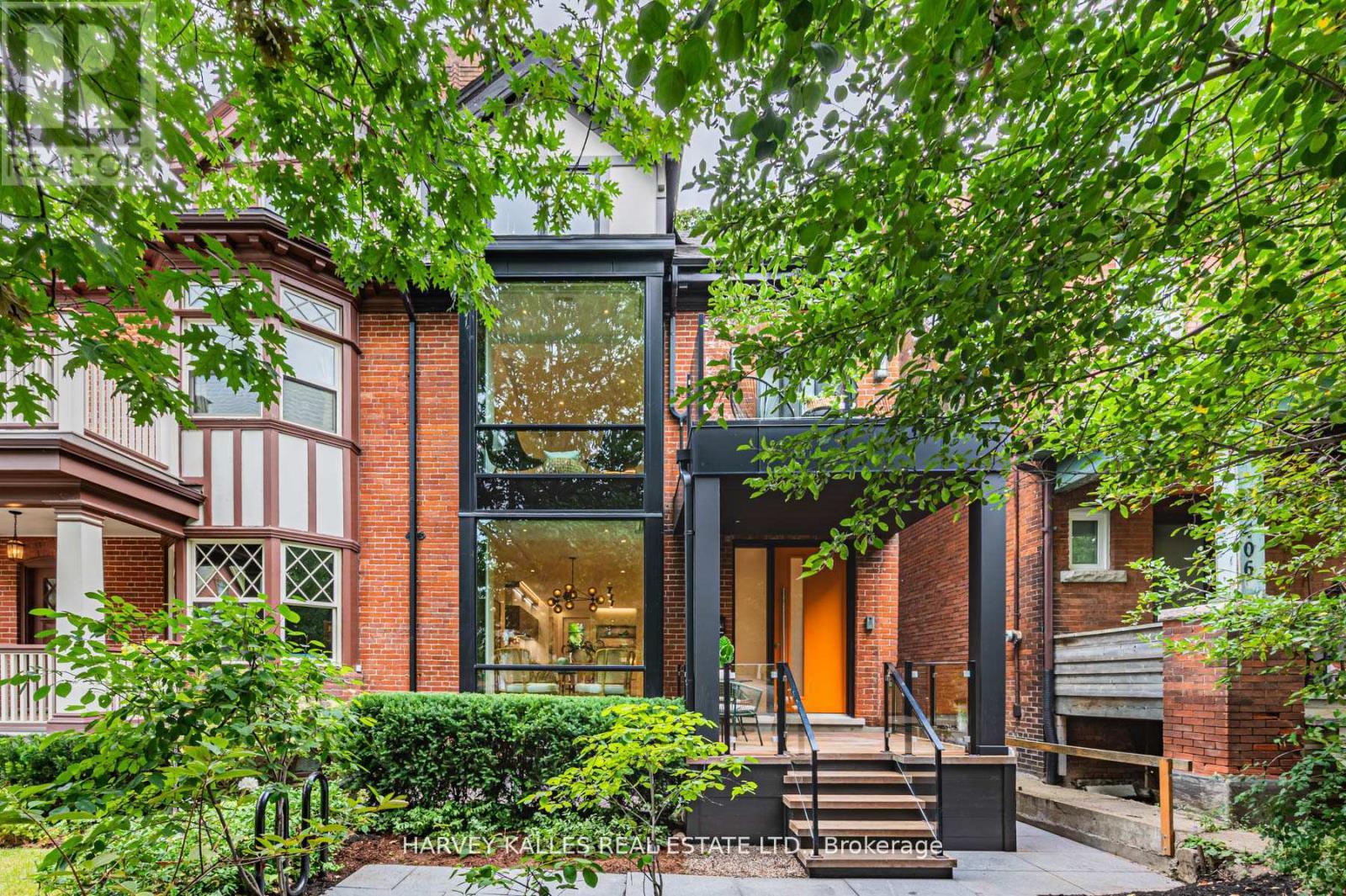 Located just steps from Bloor Street on one of the most desirable blocks in the Annex, this exquisite home is filled with nearly 3,800 Sq Ft of elevated, livable elegance. From the moment you enter, you're drawn through thoughtfully designed spaces with an architectural staircase winding through 4 levels. The open-concept main floor flows perfectly for both memorable entertaining & intimate gatherings with light that pours in from floor-to-ceiling windows. A culinary paradise in the sleek kitchen boasts integrated appliances, smooth countertops and a mix of high-gloss cabinetry & exquisite custom millwork. A warm, inviting sitting room beckons viewing parties with the TV feature wall & contemporary gas fireplace, illuminated by recessed lighting. Take a leisurely promenade via sliding doors to the newly-built deck with gas connection & garden terrace with fire table. Generous for central Toronto, there's tremendous potential in the verdant backyard. At the front of the 2nd level, a large suite features its own balcony & ensuite bath. There's no need to settle any sibling rivalries over who gets the best room with two delightful bedrooms that share a bathroom w/ double sinks; perfect for busy mornings. A hallway closet with rough-in for laundry offers added convenience to this family-friendly layout. The entire 3rd floor is dedicated to the serene Primary with 2 organized walk-in closets and a spa-inspired ensuite with heated floors, freestanding tub & separate WC for added privacy. Step out onto the oversized deck to take in leafy, panoramic views while unwinding in style. The fully finished lower level presents space for family activities, a home gym, plus a 5th bedroom & full bath. This turn-key home is replete with upgrades like built-in speakers & discreet switch-controlled window coverings in all of the principal rooms. Discover the best of the city by foot/bike with nearby parks, schools, world-class shopping, dining, museums & effortless access to the subway. (id:48254)
