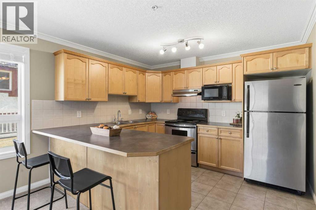 103, 128 Centre Avenue, Cochrane, Alberta T4C 2K5 - Photo 12 - A2266383