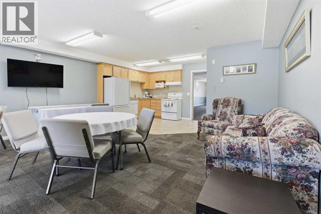 103, 128 Centre Avenue, Cochrane, Alberta T4C 2K5 - Photo 25 - A2266383