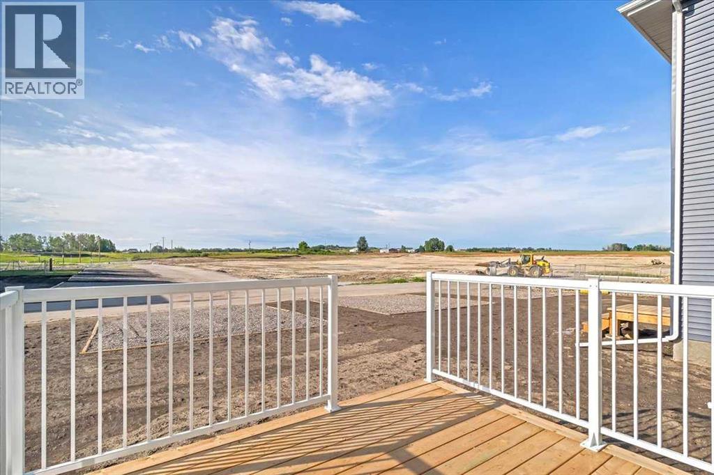 74 Wedderburn Drive, Okotoks, Alberta  T1S 5X2 - Photo 7 - A2277430