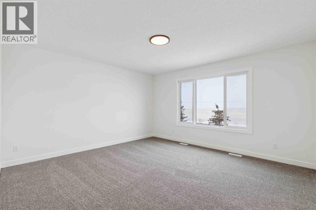 146 Northern Lights Crescent, Langdon, Alberta  T0J 1X2 - Photo 21 - A2283455