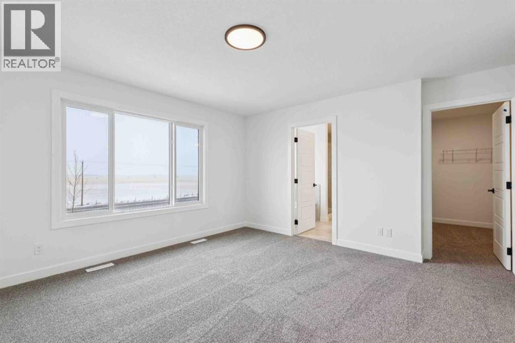 146 Northern Lights Crescent, Langdon, Alberta  T0J 1X2 - Photo 22 - A2283455