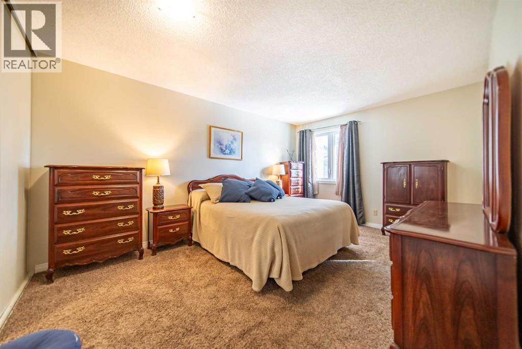 216 Coachway Lane Sw, Calgary, Alberta  T3H 2V9 - Photo 16 - A2288871