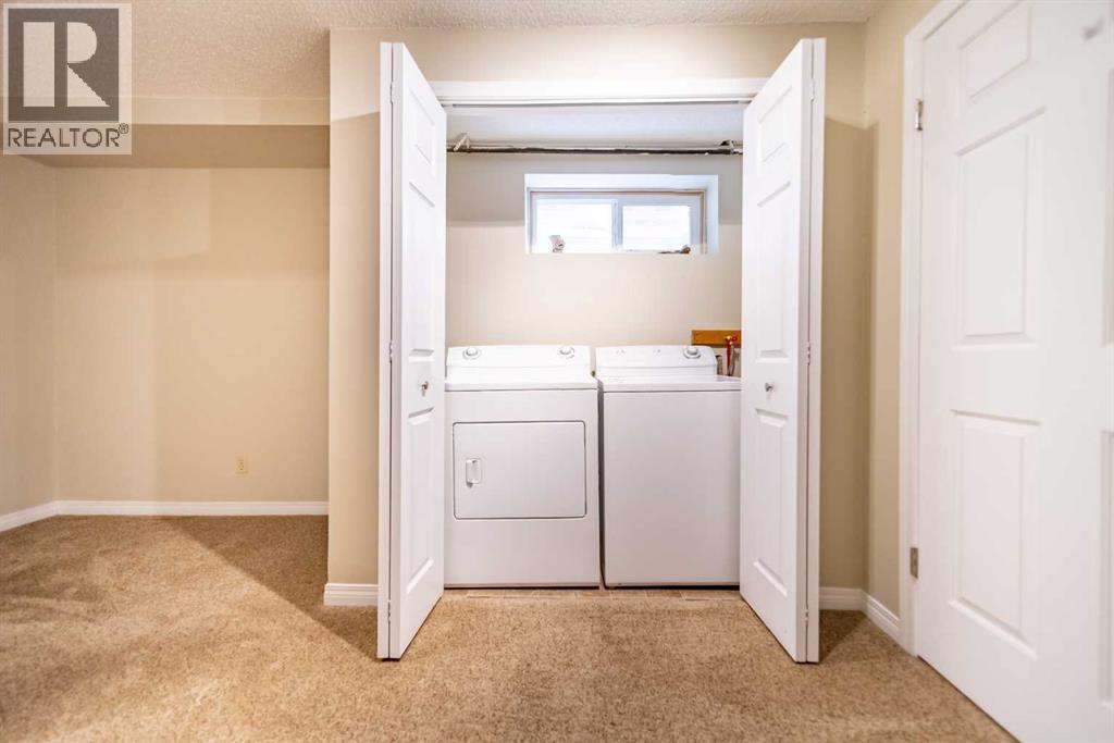 216 Coachway Lane Sw, Calgary, Alberta  T3H 2V9 - Photo 27 - A2288871