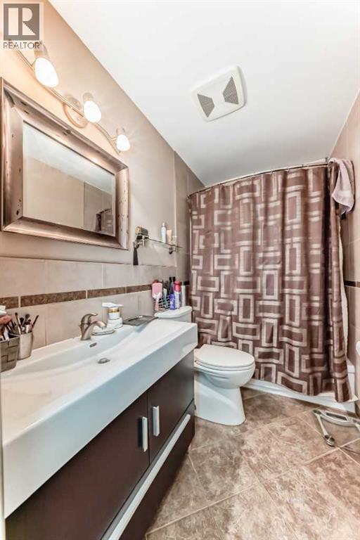 208 Bracewood Road Sw, Calgary, Alberta  T2W 3C1 - Photo 19 - A2280350