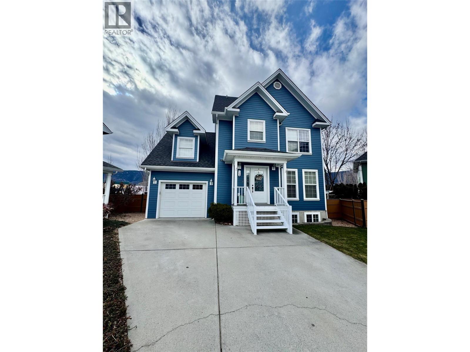 Welcome Hastings Ave in a desirable Penticton location, offering the perfect blend of modern design, quality craftsmanship, and functional living. Featuring 4 bedrooms and 3 bathrooms, plus a fully finished basement, this home provides ample space for families, guests, or multi-generational living. Step inside to discover hardwood and ceramic tile flooring, enhanced by striking ceiling details and elegant recessed lighting that create a warm yet sophisticated atmosphere. The open-concept main living area is complemented by  stainless steel appliances, making the kitchen both stylish and practical for everyday living and entertaining. The lower level is thoughtfully finished with a professionally built bar and spacious family room—ideal for hosting—along with a convenient 3-piece bathroom, creating a perfect retreat for guests or a relaxing entertainment space. Enjoy outdoor living on the back deck complete with an awning for shade and comfort, while the inground irrigation system ensures easy maintenance of the landscaped yard.  With numerous thoughtful upgrades and attention to detail throughout, this home truly stands out. Don’t miss your opportunity to experience everything this impressive property has to offer. (id:48254)