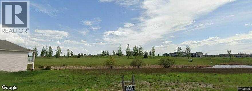 617 Whispering Greens Avenue, Vulcan, Alberta  T0L 2B0 - Photo 2 - A2288434