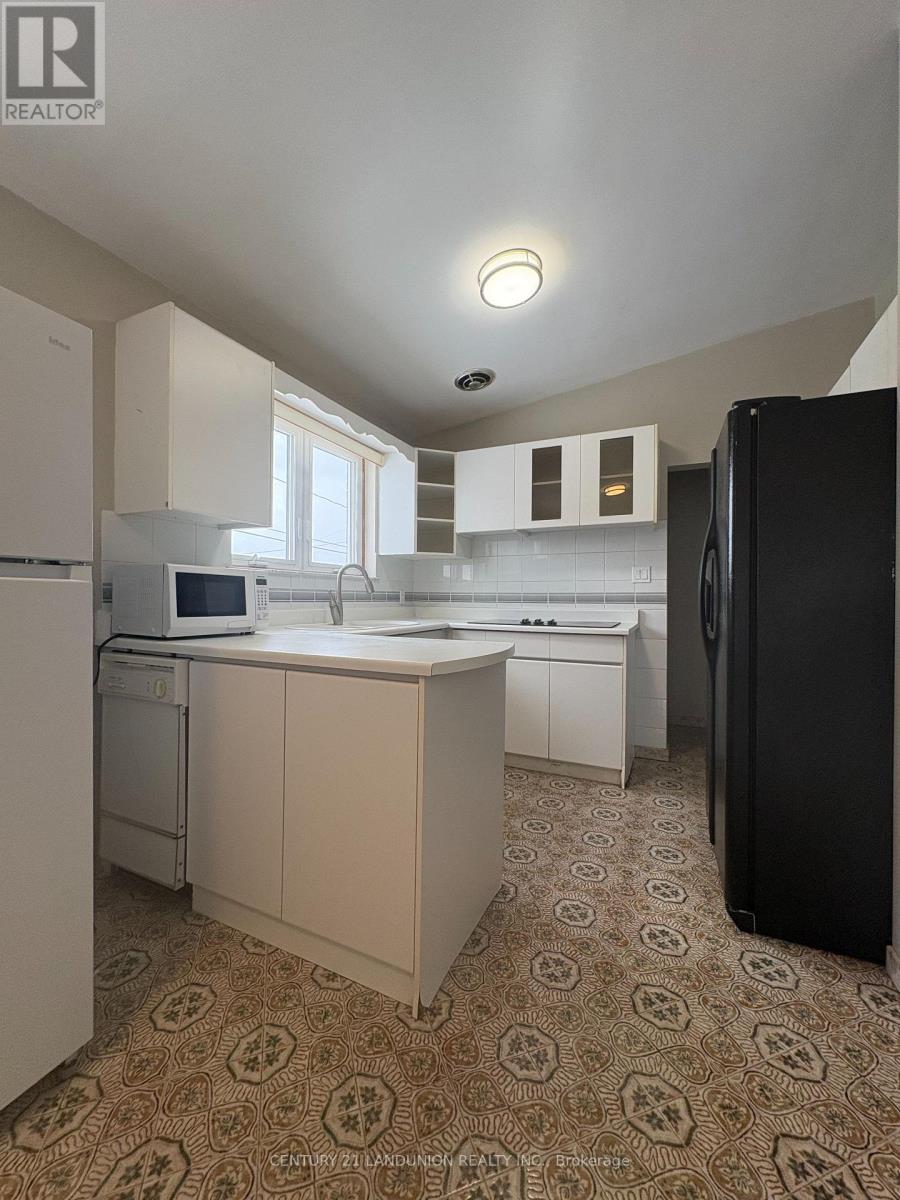 1 Brady Crescent, Toronto, Ontario  M3L 2B6 - Photo 2 - W12834264