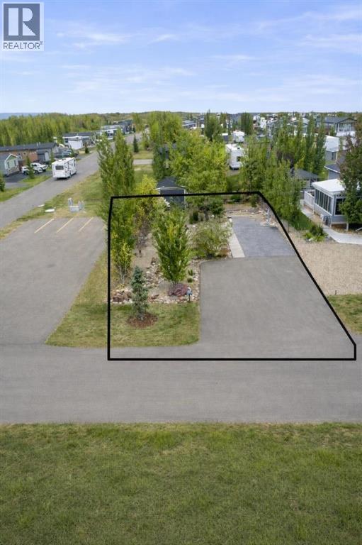Are you ready to own your spectacular lake lot in phase 1 at Sandy Point located on the west side of Gull Lake!  This gorgeous lot has lots of mature trees providing shade and privacy.  Imagine sitting by the firepit on those warm sunny evenings and enjoying company who can park right next door in the guest parking!  A 10 x 15 shed with hardy board siding plus a washer & dryer, built in shelving and ample storage come with the property.  This lot supports a wide range of housing options including a park model, motorhome, manufactured home, fifth wheel  or trailer.  The lot measures 45' wide by 95' deep with enough room for 2 vehicles, plus a boat and golf cart.  Sandy Point is a gorgeous gated community  with amenities that include GOLF COURSE, playgrounds, laundry facilities, showers, bathrooms, laundry facilities and of course the BEACH!  This lot also features some raised garden beds for your herbs and/or flowers.  Other amenities that are close are a seasonal restaurant with a rooftop patio, convenience store, marina with propane and gas facilities, driving range,  gated storage compound, and community garden area.  MAKE THIS LOT YOURS TODAY! (id:48254)