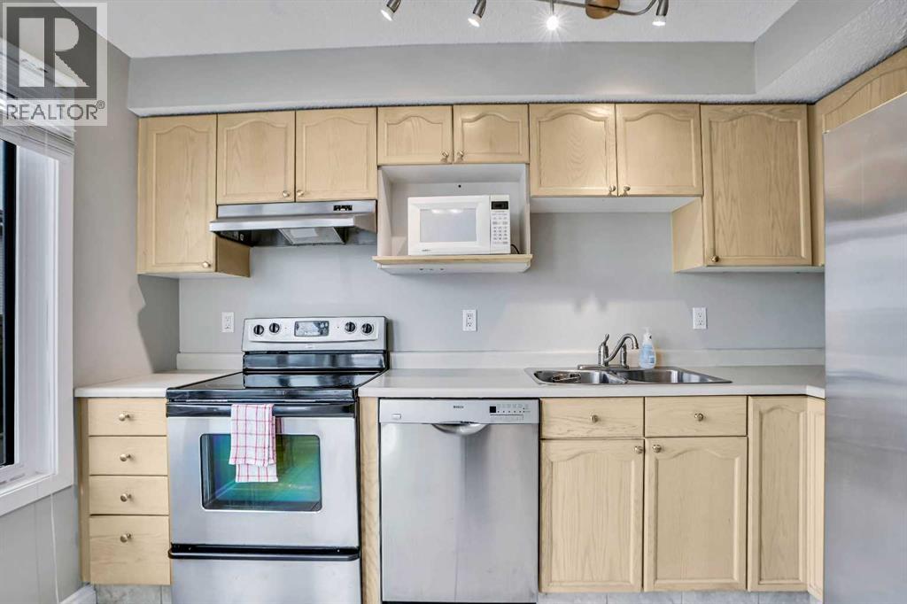 219 Coachway Lane Sw, Calgary, Alberta  T3H 1A4 - Photo 4 - A2278972