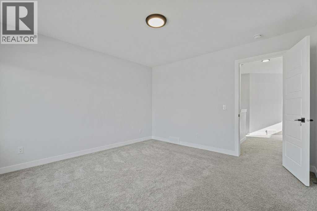 71 Ranchers View, Okotoks, Alberta  T1S 5R6 - Photo 26 - A2285159