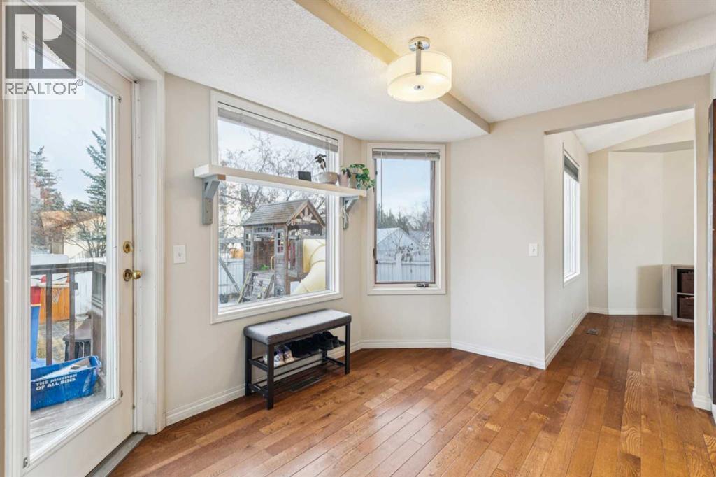 124 Woodmark Crescent Sw, Calgary, Alberta  T2W 4Z2 - Photo 6 - A2281355