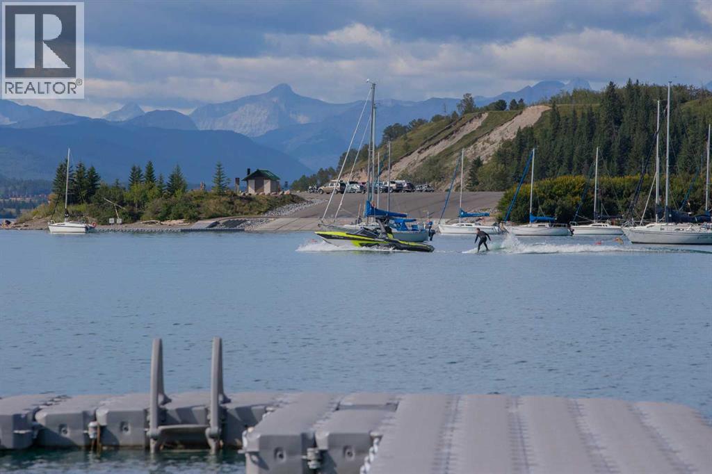 602 Cottageclub Bend, Rural Rocky View County, Alberta T4C 1B1 - Photo 3 - A2278549