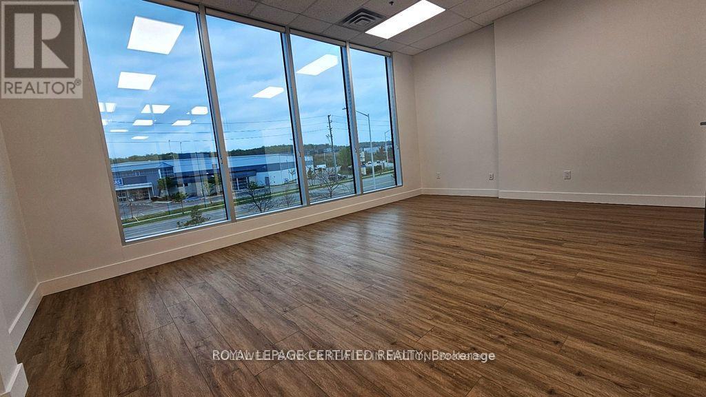 115 - 1660 North Service Road, Oakville, Ontario  L6H 7G3 - Photo 2 - W12843054