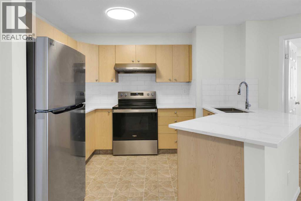 104, 16 Country Village Bay Ne, Calgary, Alberta  T3K 5Y9 - Photo 3 - A2289125