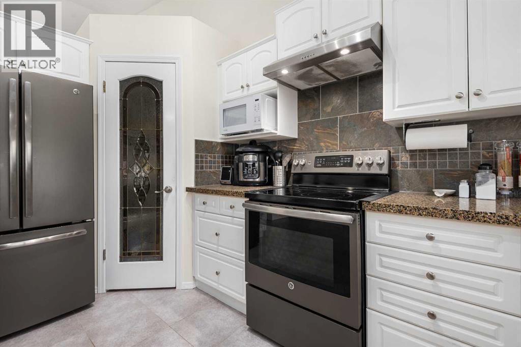 704 Woodside Drive, Airdrie, Alberta  T4B 2G9 - Photo 18 - A2284096