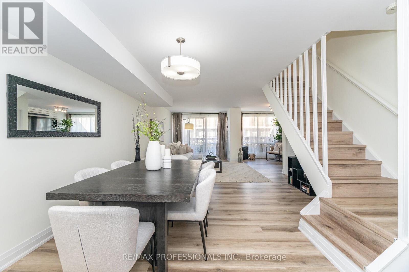 1465 Square Feet of Stunning Living Space! Beautifully Renovated 2 Storey, 3 + 1 Bedroom, 3 Bathroom Unit with Both a Terrace & Balcony. This Open Concept Design Includes a Bright Living Room, Dining Room Plus a Renovated White Kitchen with a Centre Island, Quartz Countertops &Stainless Steel Appliances. Large Primary Bedroom with Walkout to Balcony, Wall-To-Wall Built-In Closets & 4-Piece Ensuite. Maintenance Fee Includes Utilities + Cable TV (Internet Extra). Amenities-24 Hr. Security, 2 Pools, Gym++ Walking Distance to Schools, Loblaw, Park, Restaurant, Bank, Library & Transit. Close to Major Hwys, Centennial Park Sports Complex, Golf Course, Airport & Downtown Toronto. (id:48254)