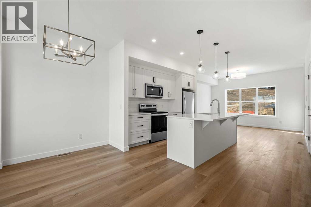 1804, 525 River Heights Drive, Cochrane, Alberta  T4C 3E4 - Photo 2 - A2286055