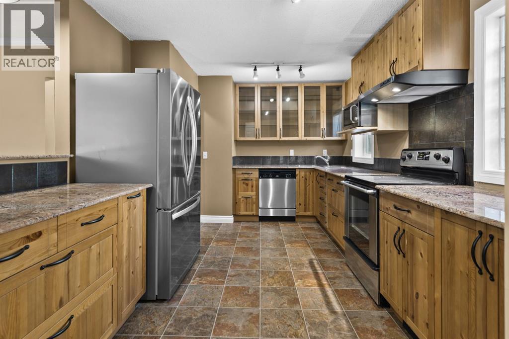 4416 Quentin Court Sw, Calgary, Alberta  T2T 6B9 - Photo 6 - A2286415