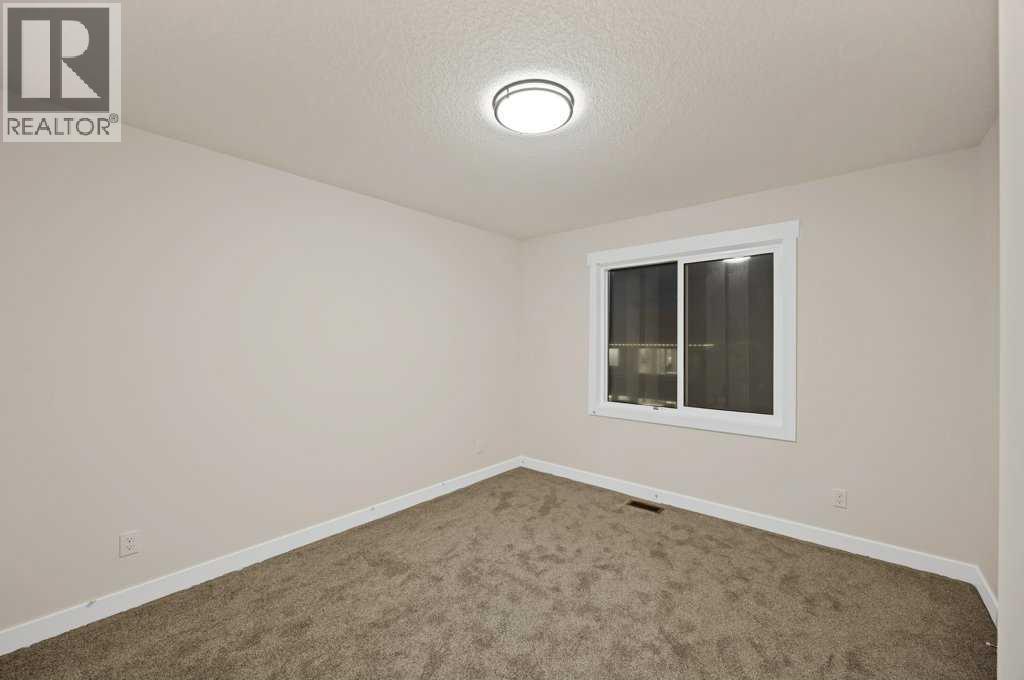 7 Chelsea Port Link, Chestermere, Alberta  T1X 3H4 - Photo 35 - A2280523