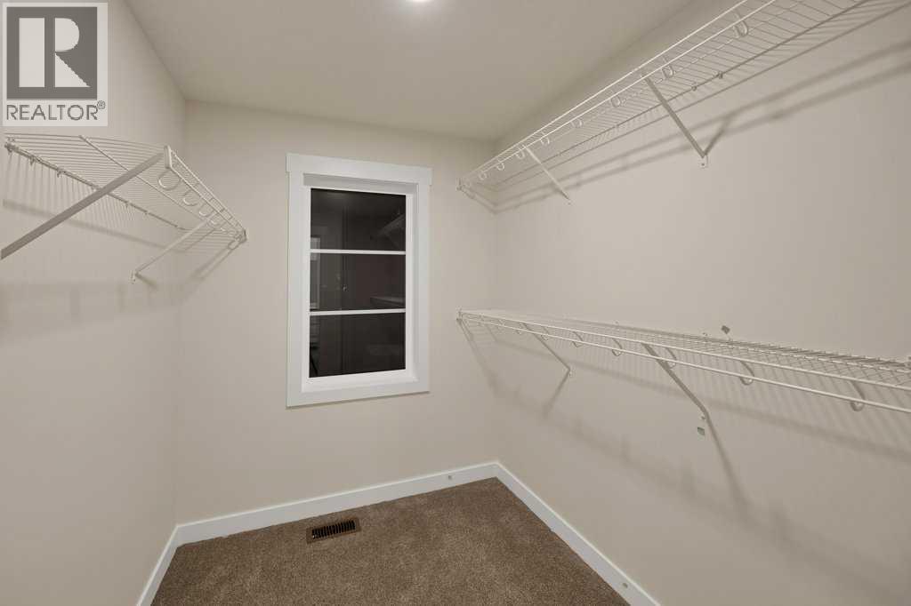 7 Chelsea Port Link, Chestermere, Alberta  T1X 3H4 - Photo 27 - A2280523