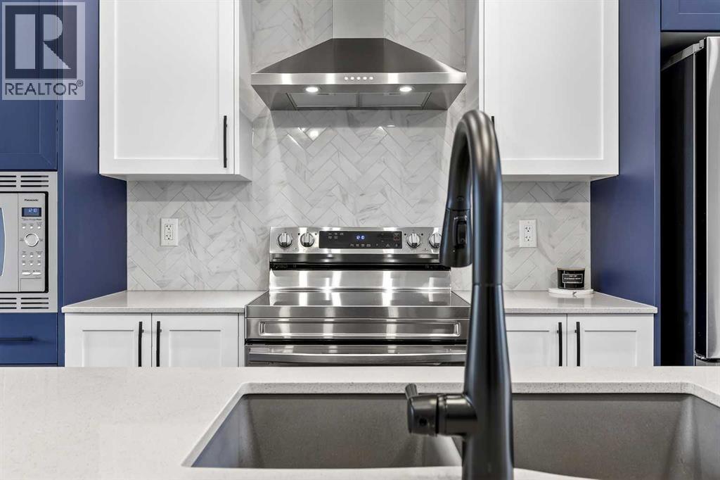 94 Wolf Gate Nw, Okotoks, Alberta  T1S 5T9 - Photo 7 - A2290958