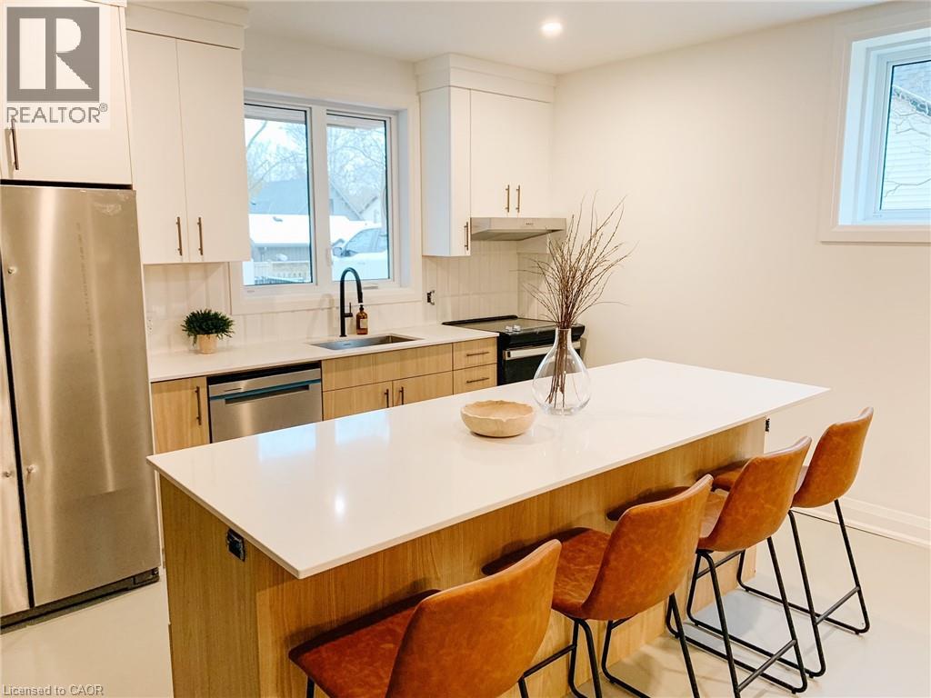 Welcome to Suite 102 at the 150 Alma Luxury Apartments in the heart of Rockwood. Suite 102 offers a spacious layout with 2 bedrooms & 1.5 bathrooms. Meticulously designed, this accessibility friendly suite has a barrier free entrance and pathways & widened doorways and hallways. Finished top to bottom with elegant finishes, designer kitchen & bathrooms, heated polished concrete flooring, smart home technology and a private patio. The designer kitchen is equipped with accessibility friendly stainless steel appliances, quartz countertops and custom cabinetry. The primary bedroom features a 3 piece ensuite. This suite is complete with 1 parking space. Simply move in and enjoy a worry-free chic lifestyle! (id:48254)