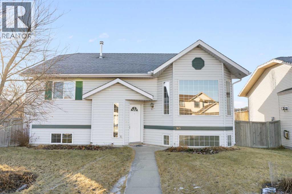 165 Quigley Drive, Cochrane, Alberta  T4C 1R4 - Photo 2 - A2290069