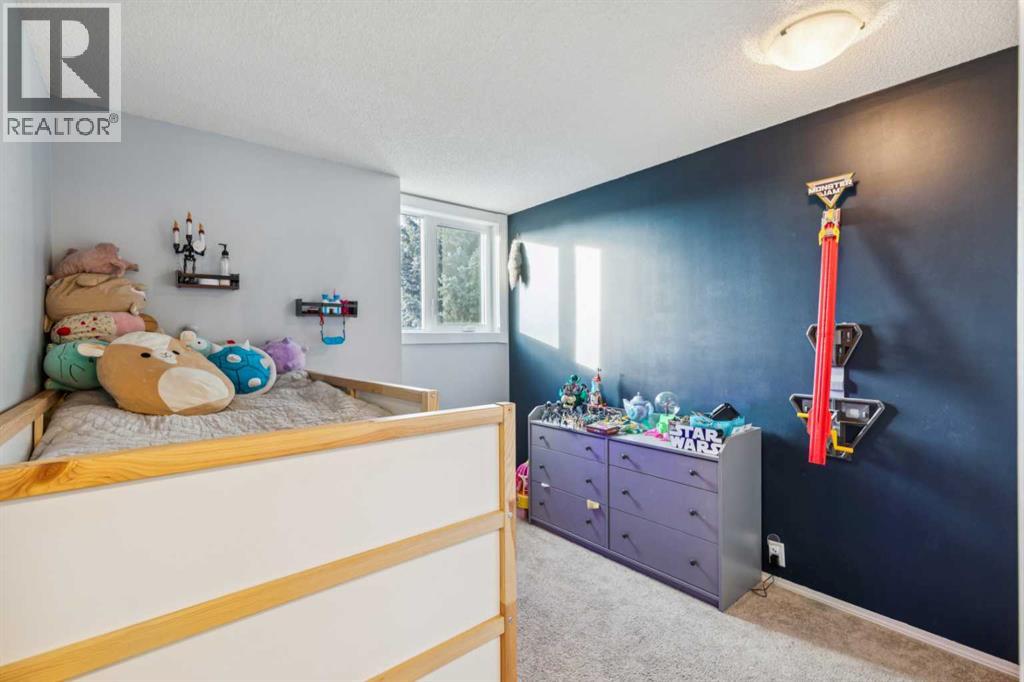 124 Woodmark Crescent Sw, Calgary, Alberta  T2W 4Z2 - Photo 26 - A2281355