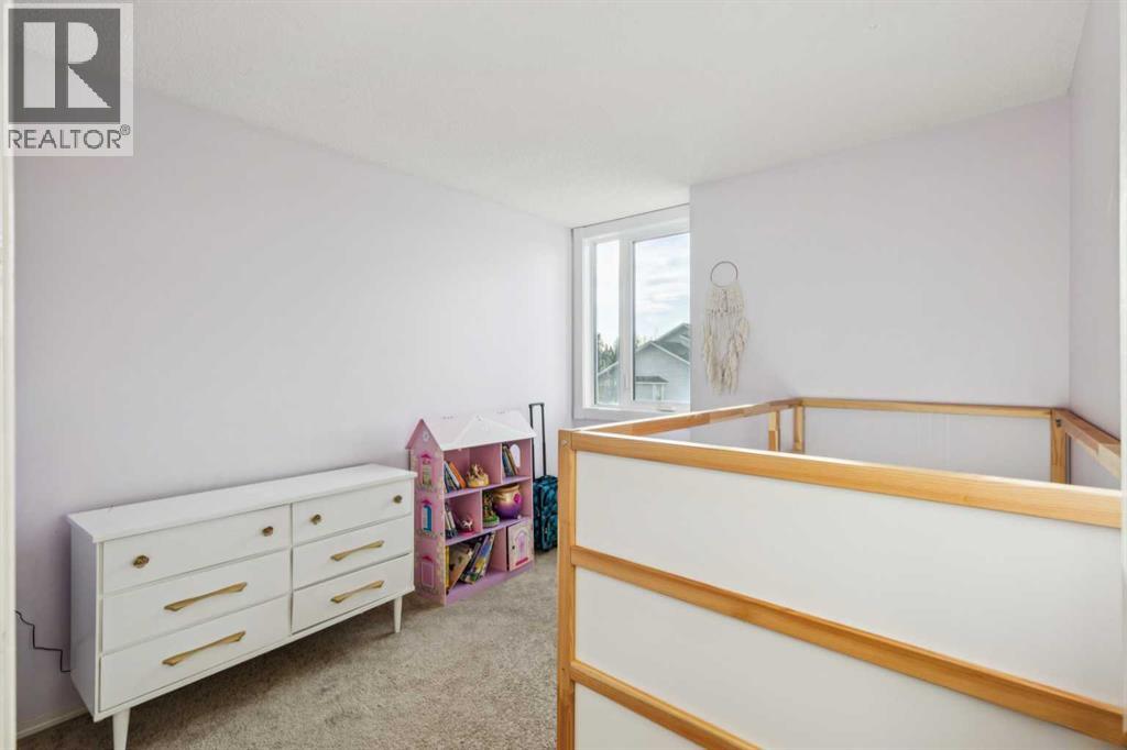 124 Woodmark Crescent Sw, Calgary, Alberta  T2W 4Z2 - Photo 27 - A2281355