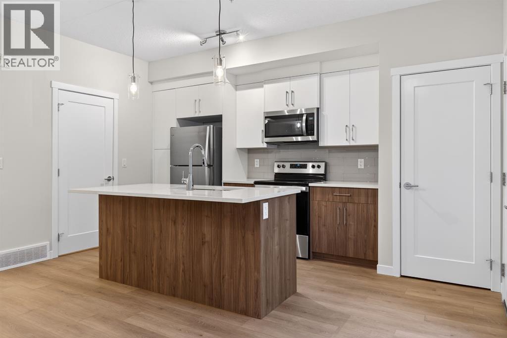 203, 400 Belmont Street Sw, Calgary, Alberta T2X 4C1 - Photo 4 - A2280708