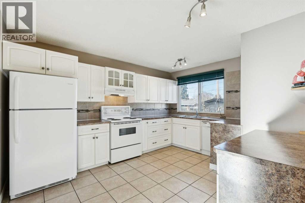 248 Huntcroft Road Ne, Calgary, Alberta  T2K 4E2 - Photo 11 - A2284788