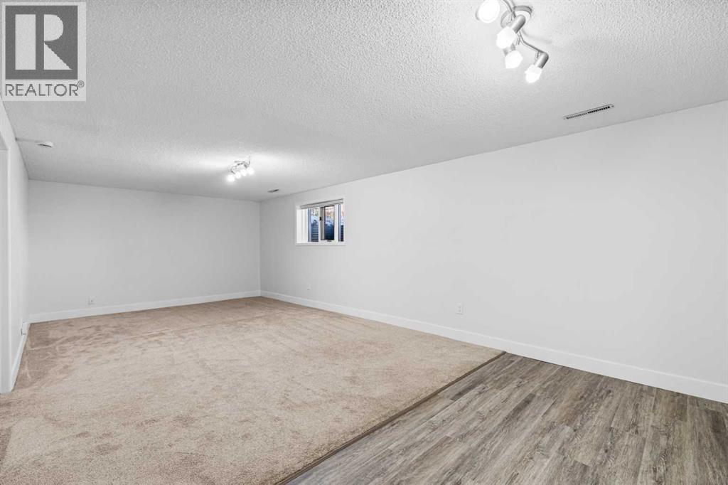 1007 Hunterston Place Nw, Calgary, Alberta  T2K 4N5 - Photo 24 - A2287224