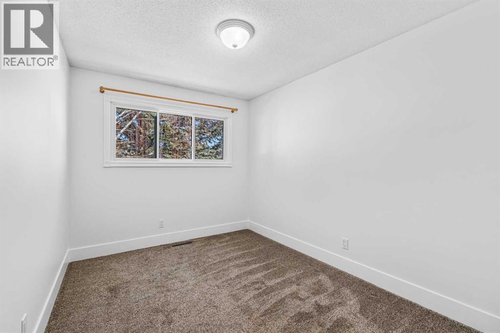 1007 Hunterston Place Nw, Calgary, Alberta  T2K 4N5 - Photo 21 - A2287224