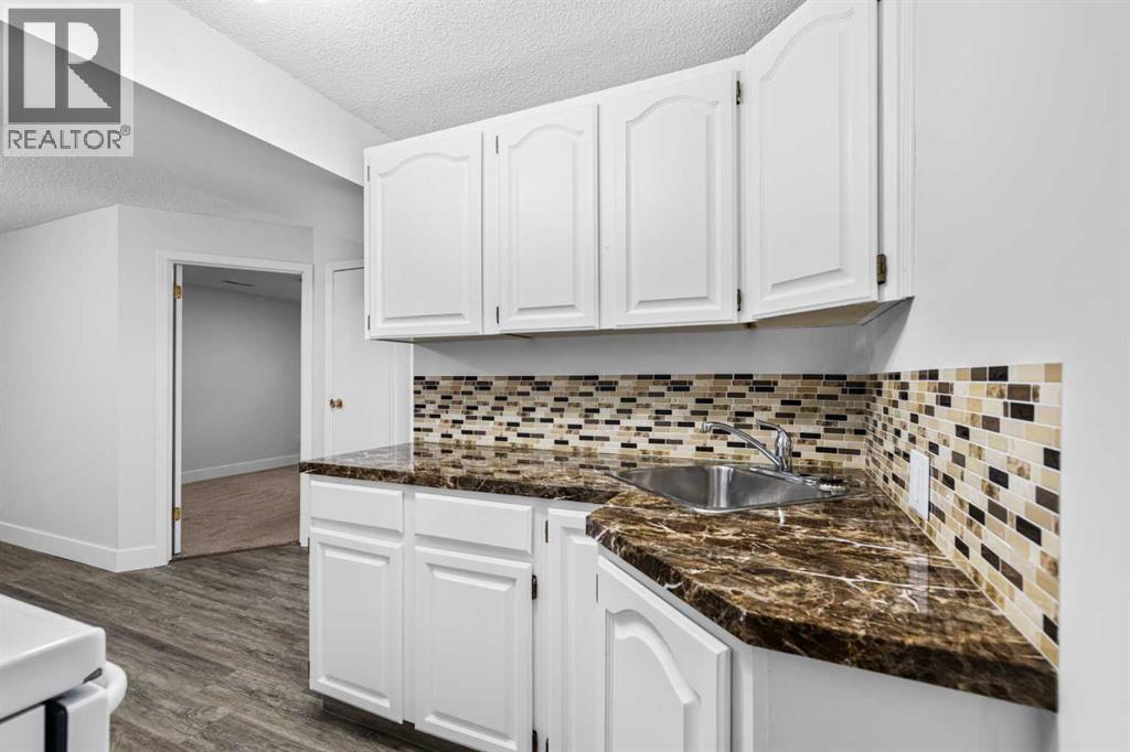 1007 Hunterston Place Nw, Calgary, Alberta  T2K 4N5 - Photo 31 - A2287224