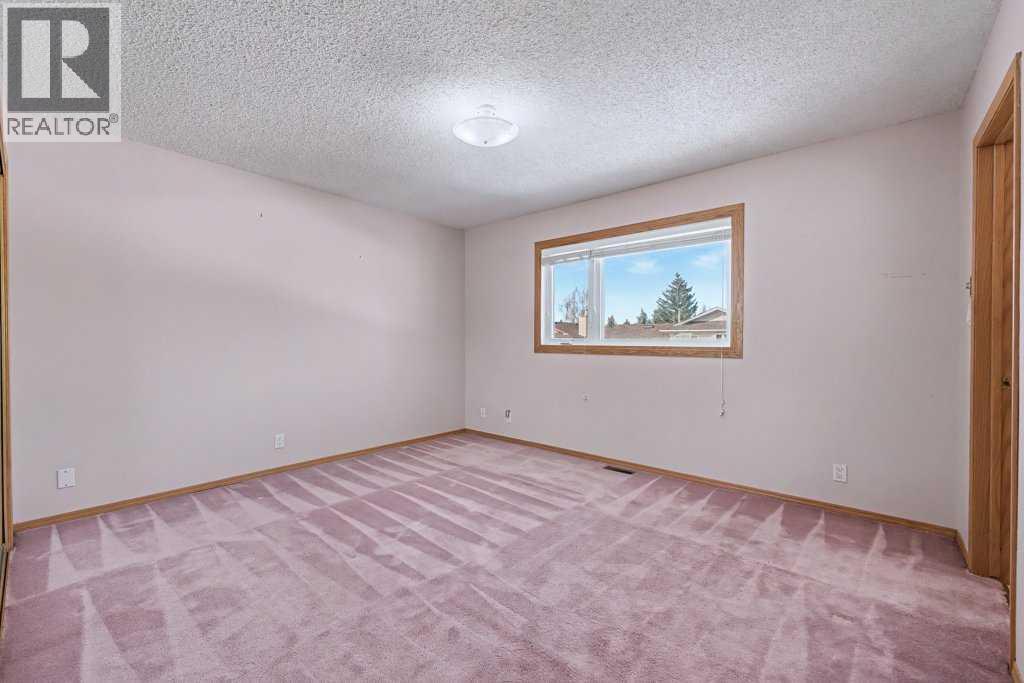 82 Wood Valley Drive Sw, Calgary, Alberta  T2W 5V6 - Photo 27 - A2290576