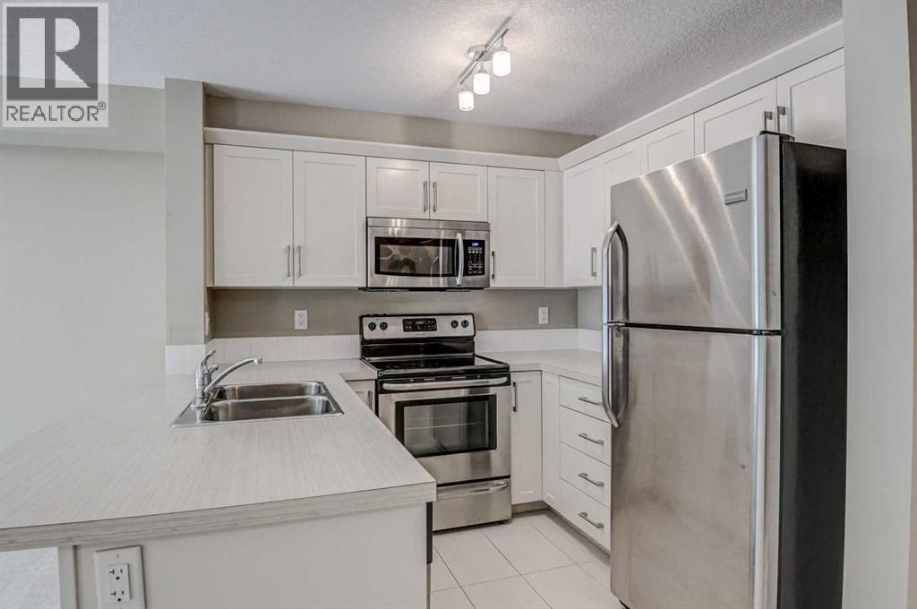 2217, 130 Panatella Street Nw, Calgary, Alberta  T3K 0Y6 - Photo 4 - A2282406