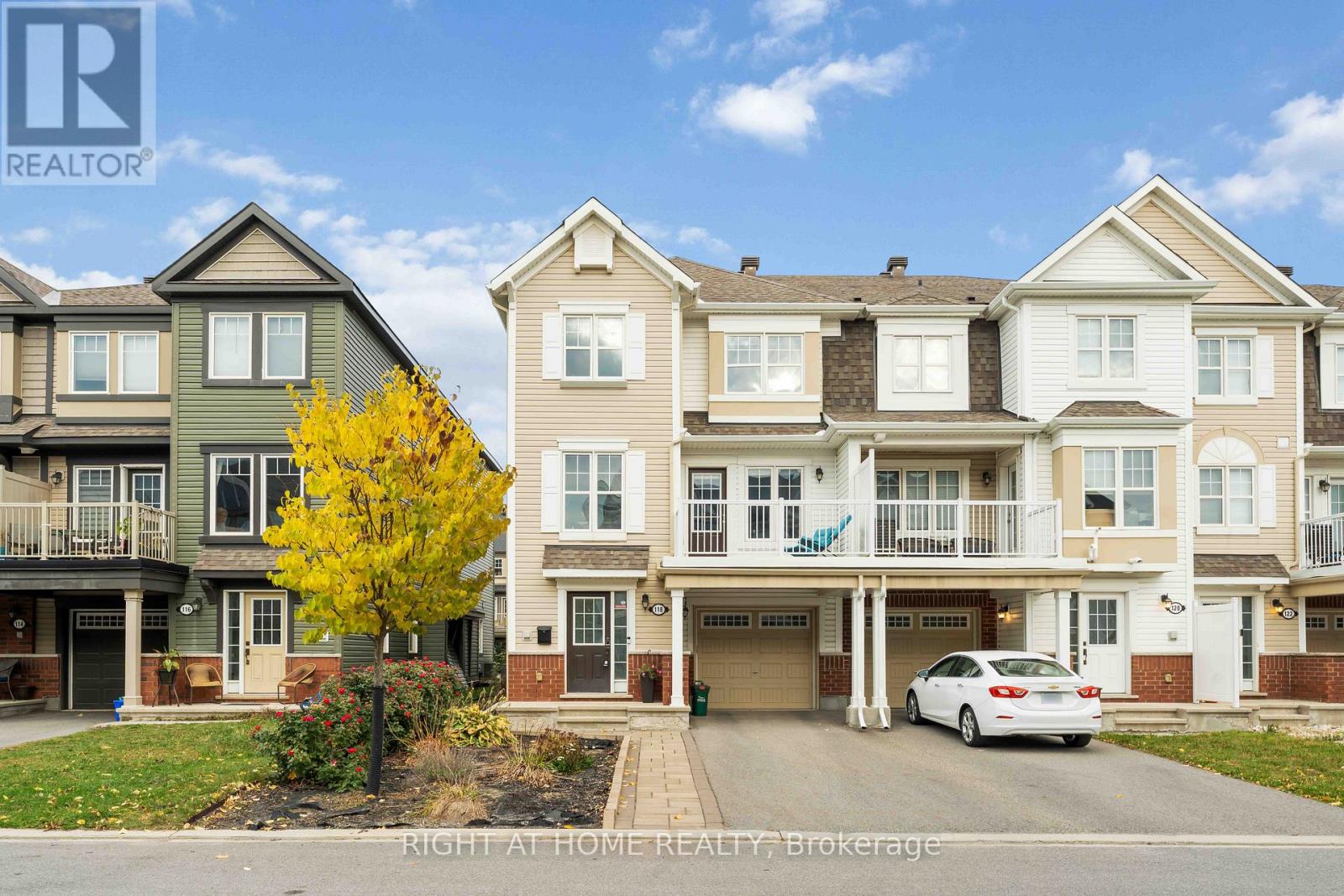 Welcome Home to Modern Comfort and Style in Avalon! Experience the perfect blend of elegance and functionality in this show stopping, immaculate, move-in-ready end-unit townhome in the highly sought-after Avalon community. Built in 2018, this 2-bedroom, 2.5-bath gem offers 1,473 sq ft of bright, open living space, filled with natural light, high-end finishes, and thoughtful upgrades throughout.Step into a spacious foyer that sets the tone for the home, featuring interior garage access, a well-designed laundry area, and a convenient powder room for guests.The main living level showcases gleaming hardwood floors and a chef-inspired kitchen with a massive quartz island, stainless steel appliances, and abundant storage-perfect for cooking, entertaining, or enjoying family meals. The open-concept living and dining area flows seamlessly onto a sun-filled balcony, ideal for relaxing or your morning coffee.Upstairs, the spacious primary bedroom offers a calm, inviting retreat, complemented by a beautifully finished full bathroom with a large standing shower, double sinks, and a generous vanity. A second bright bedroom and an additional full bathroom complete the upper level.This end-unit home offers extra privacy, sunlight from three sides, and professional interlock landscaping that enhances its curb appeal. Located just minutes from the new hospital, top-rated schools, parks, shopping, restaurants, and transit, this home delivers modern elegance, comfort, and convenience. Move-in ready with premium upgrades and an unbeatable location-this is the one you've been waiting for! Offers to be presented March 15th at 6:00 PM. Seller will not review or accept any pre-emptive offers prior to that date. (id:48254)