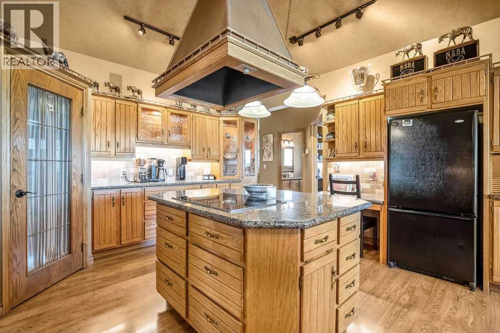 100, 182029 174 Avenue W, Priddis, Alberta  T1S 2B8 - Photo 17 - A2229058