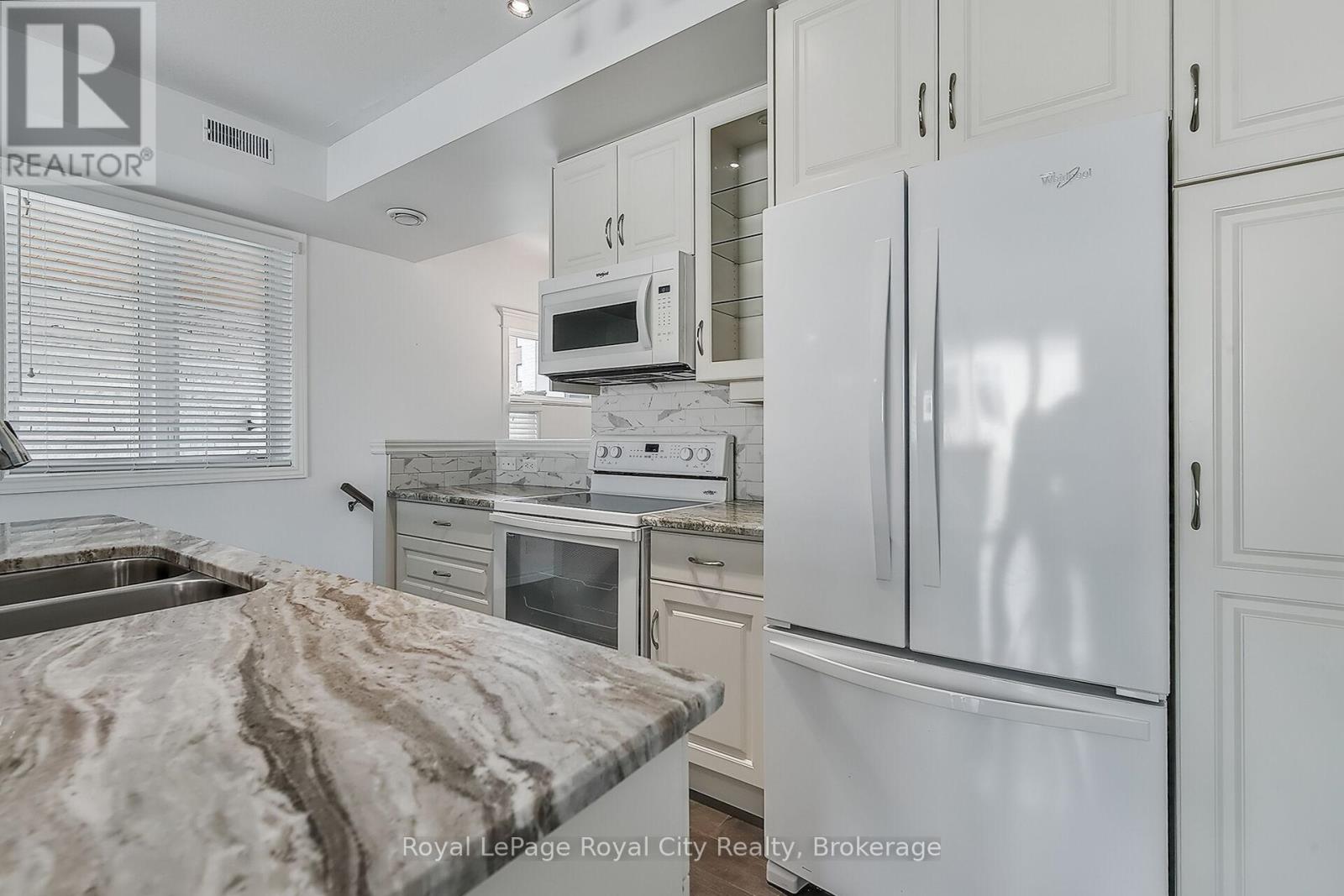 2 - 32 Arkell Road, Guelph, Ontario N1L 0L4 - Photo 8 - X12860072