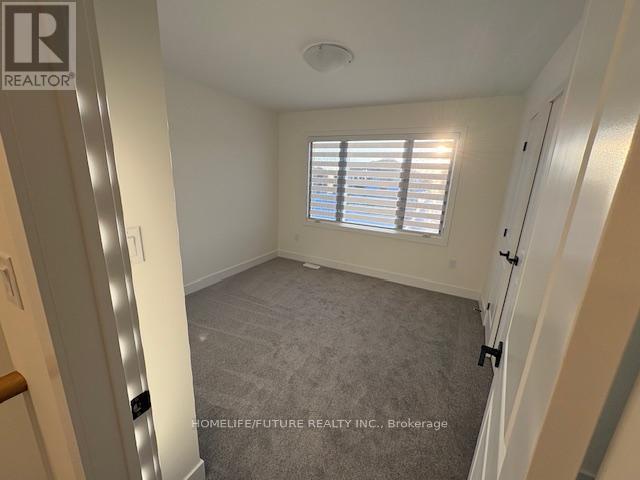 77 Dusenbury Drive, Loyalist, Ontario  K0H 2H0 - Photo 6 - X12862416