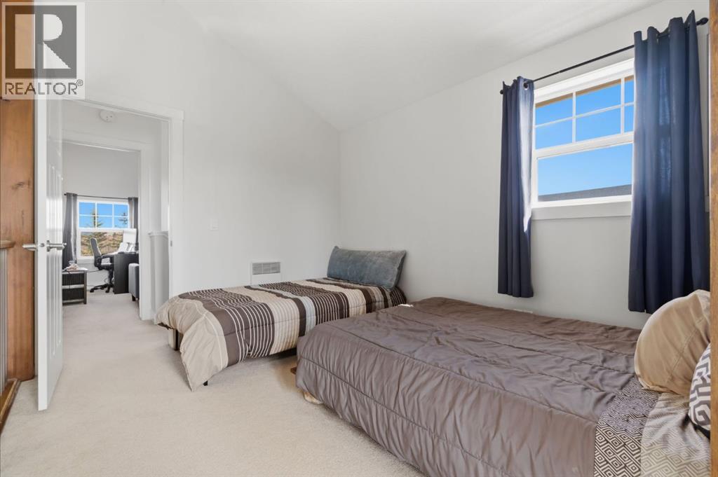 212 Cottageclub Crescent, Rural Rocky View County, Alberta  T2K 1B3 - Photo 21 - A2291790