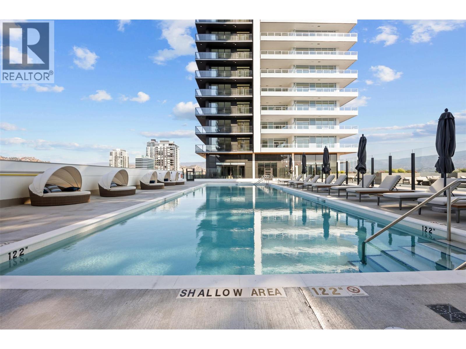 Welcome to #3207 at Water Street by The Park. Located in The Eli, T2, this three-bedroom + den residence is elevated Okanagan living just steps from the lake, yacht club, and City Park. A spacious and contemporary 1408 sq ft interior is complemented by an expansive 505 sq ft wrap-around deck offering stunning lake and park views from the 32nd floor, for seamless indoor/outdoor living. Superior-quality finishes including integrated, stainless steel Fulgor Milano appliances, marbled porcelain tile, premium vinyl plank flooring, and thoughtfully curated details throughout. Impress your guests and enhance your lifestyle with access to 42,000 sq ft of resort-style amenities designed for all year enjoyment. Over 23 thoughtfully designed spaces created for daily use, including a fitness centre overlooking the lake, yoga studio to find your flow and rejuvenating sauna & steam rooms for an “at home” spa experience. Perfect your swing on the golf simulator or sharpen your short game on the professionally designed putting greens. From booking a private screening in the theatre to enjoying a game of pool, indulging in a wine tasting, or keeping little ones entertained in the vibrant playroom—every experience is just an elevator ride away. An exceptional opportunity for anyone seeking the finest in luxury condominium living in Kelowna’s signature address. Room measurements are approx. Images are for illustration only. (id:48254)