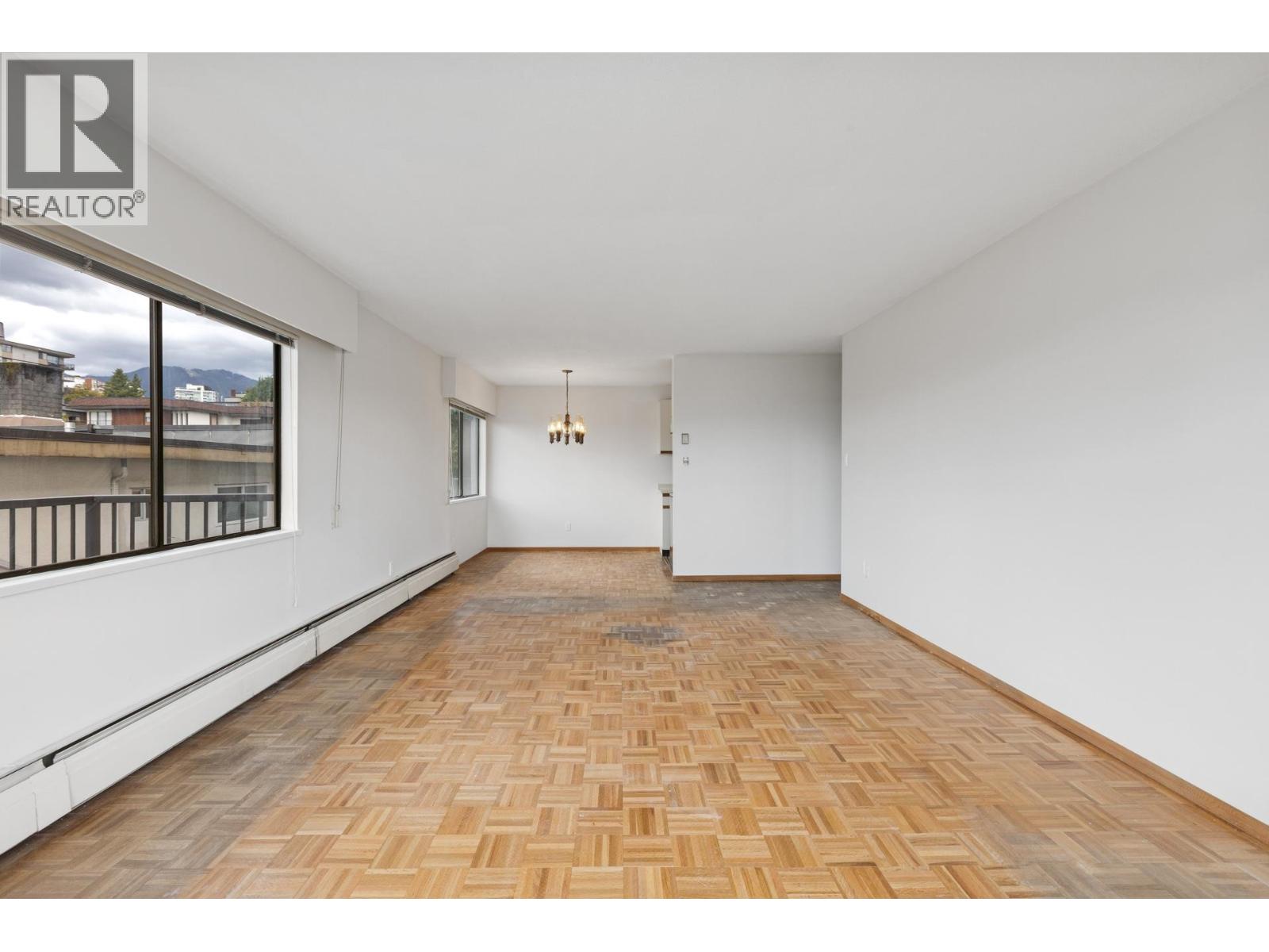 211 155 E 5th Street, North Vancouver, British Columbia  V7L 1L3 - Photo 2 - R3098767