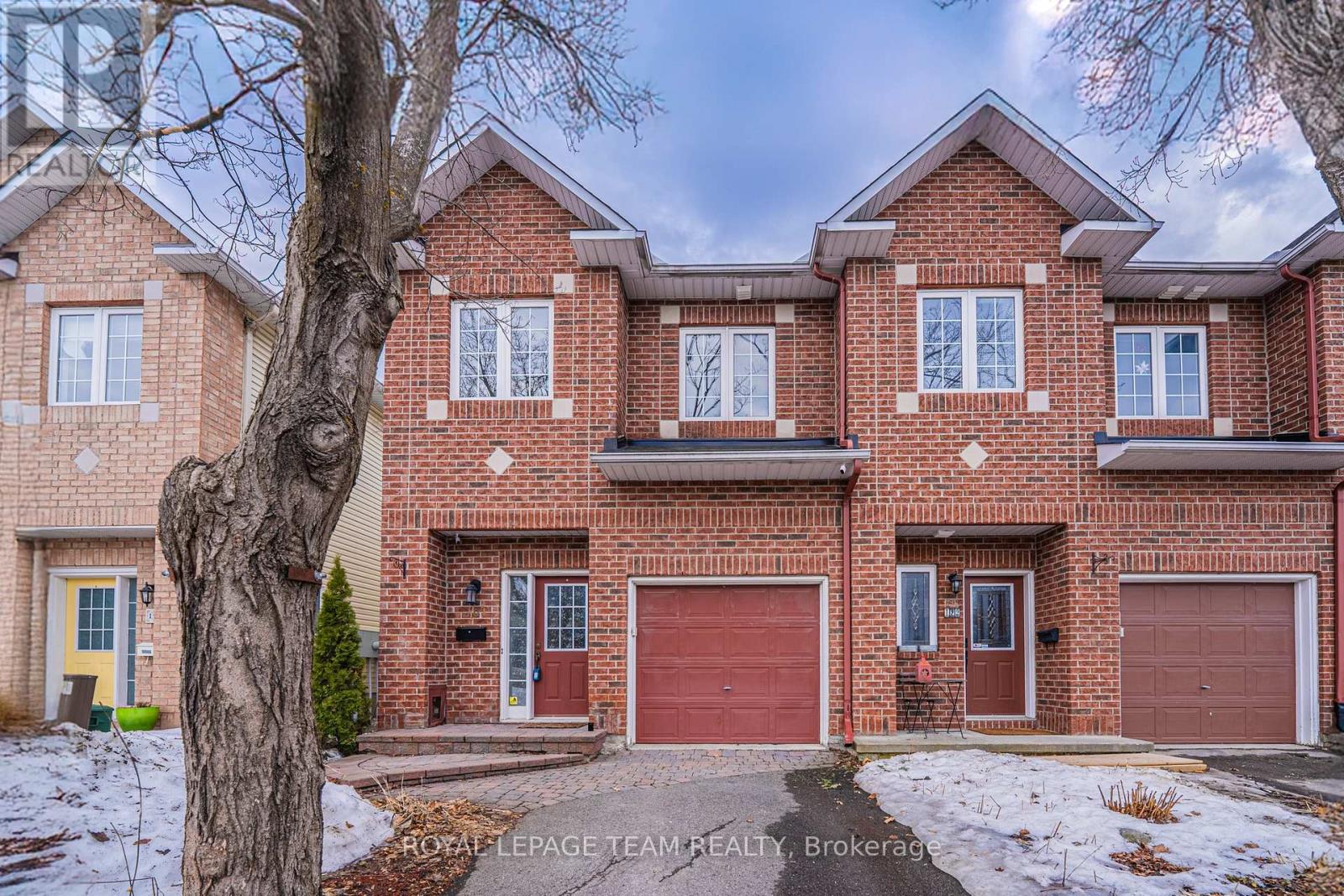 Seize the opportunity to own an exceptional home in the highly sought-after, mature Overbrook neighbourhood, defined by peaceful, friendly neighbours and unparalleled proximity to a wealth of amenities, including walking distance to Overbrook community centre, Adàwe Crossing pedestrian bridge, Downtown Ottawa, the University of Ottawa, Riverain Park, the scenic Poets Pathway along the Rideau River, and effortless access to the O-Train and HWY 417. Upon entering the main level, you are welcomed into an open, inviting living space accentuated by soaring 9-foot ceilings and expansive, south-facing windows that bathe the home in natural light, centered around a cozy gas fireplace, with a 'DESIGN FIRST' remodelled kitchen that boasts custom cabinetry for sophisticated family living, and an elegant circular staircase that provides an architectural flourish. The upper level offers a private sanctuary in the huge primary bedroom, featuring a luxurious five-piece ensuite with double sinks and a deep soaking tub, plus a walk-in closet outfitted with custom Muskoka cabinetry, alongside two additional generously sized bedrooms and a full bathroom that provide comfort and flexibility. This stylish and perfectly located end-unit townhouse is completed by a fully fenced, private backyard designed for outdoor enjoyment, featuring a two-tier deck and a relaxing hot tub, making this a brilliant opportunity to acquire a feature-rich home in the heart of Overbrook. Recent updates, including new carpet and new paint, enhance the sense of pristine modern living - Don't miss your chance to secure this exquisite residence before it's gone. (id:48254)