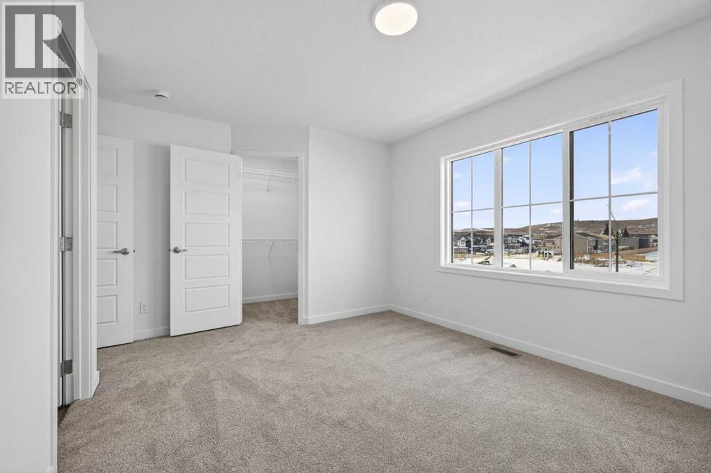 56 Creekside Drive Sw, Calgary, Alberta  T2X 6E2 - Photo 5 - A2282815